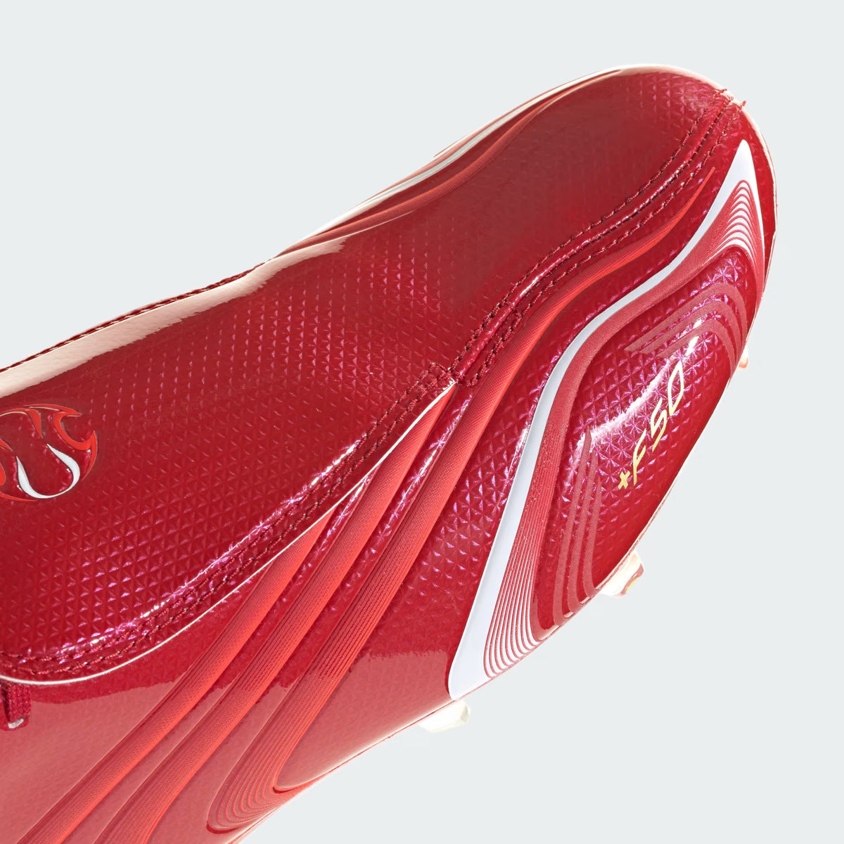 F50 Tunit Firm Ground Football Boots